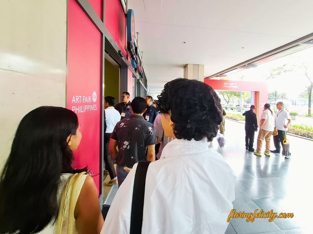 Long queue of visitors waiting at the entrance to Art Fair Philippines 2026